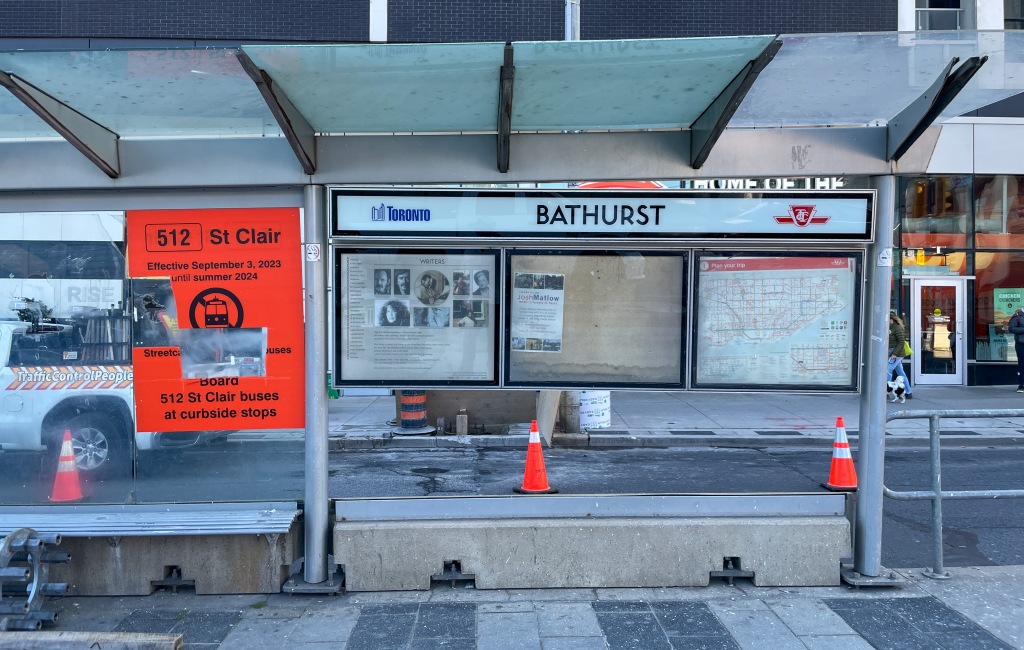Busted window showing BATHURST destination; ripped-up diversion sign